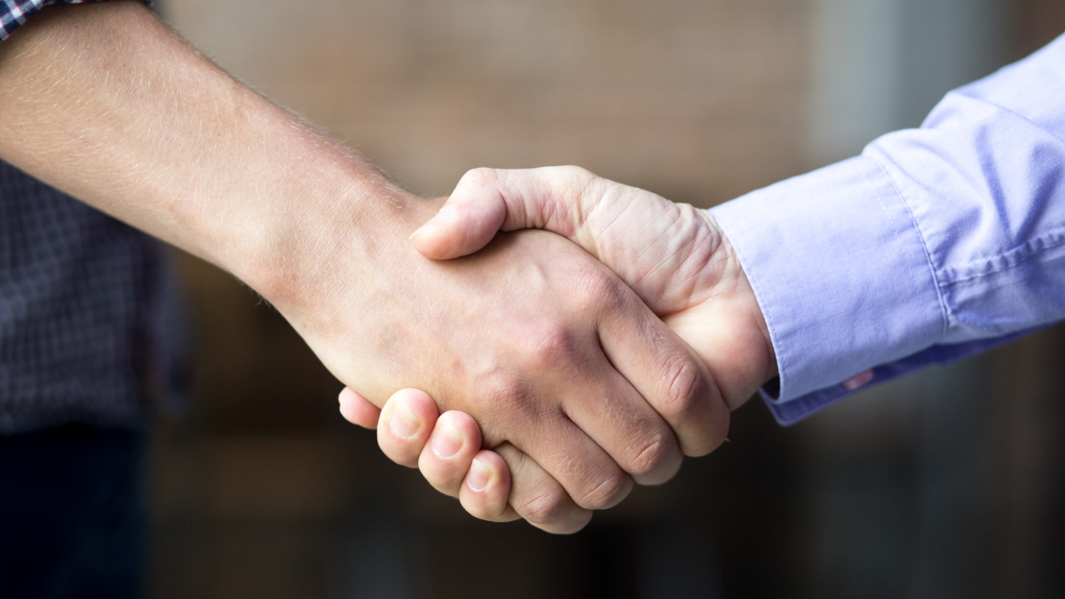 Closeup of Two Business Men Shaking Hands