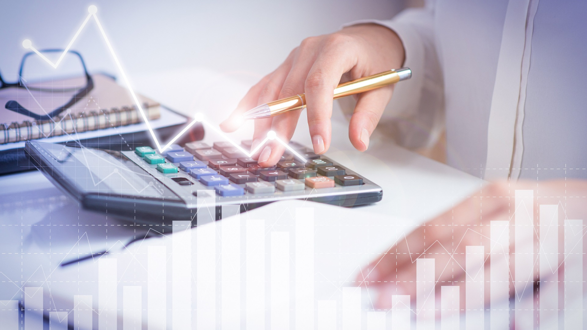 Accountant calculating profit with financial analysis graphs