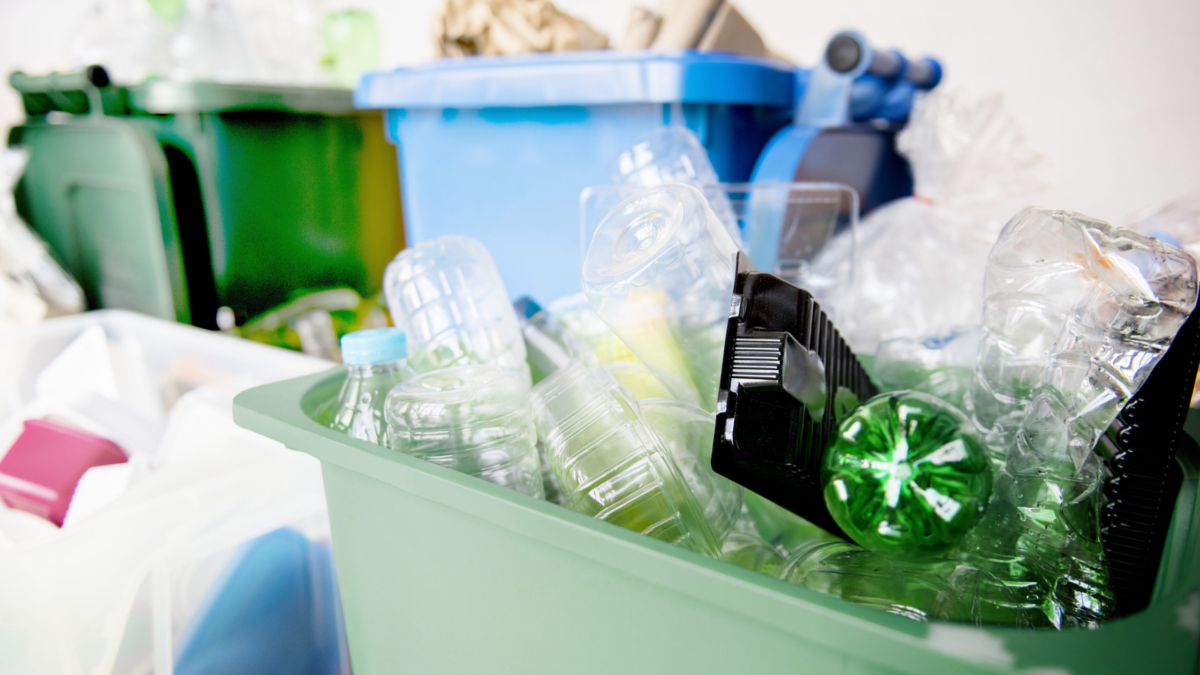 Used plastic bottles in recycling bins for earth day campaign